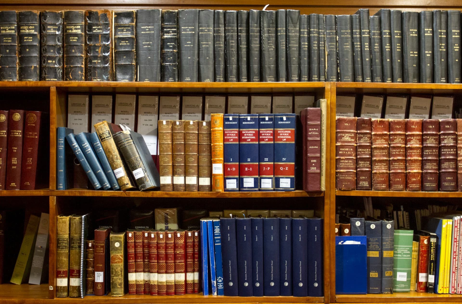 Shelves of bound legal reference volumes in a law library.